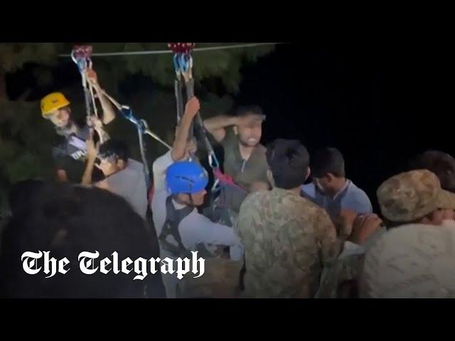 Pakistan: Moment final children are rescued from suspended cable car