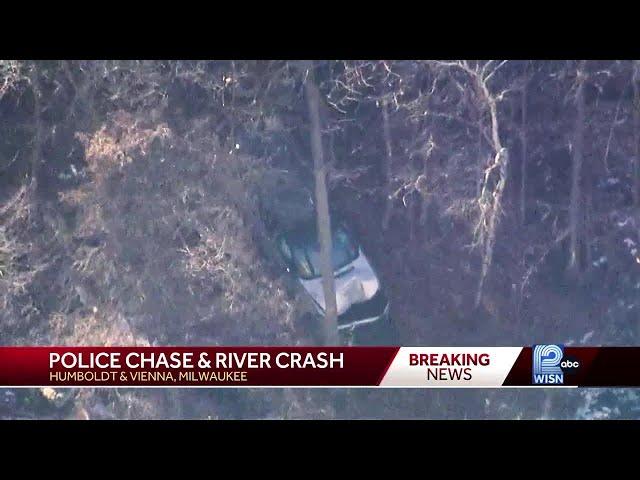 Police pursuit ends with SUV plunging down Milwaukee River bank