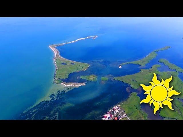 Fly over the coast of a beautiful island! We lift flocks of birds into the air! SunVideo