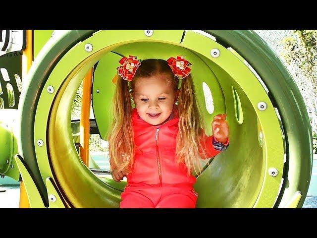 Little girl Diana have fun playing on the Outdoor playground, Kids video