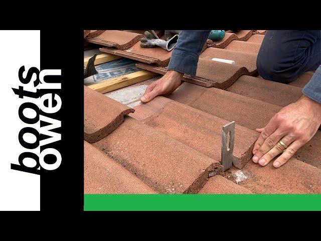 Fitting solar panel brackets to a concrete tile roof