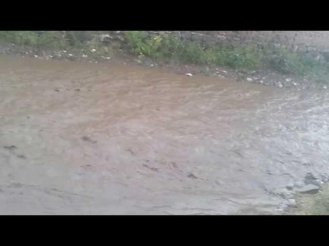 flooded street kosovo past the rain