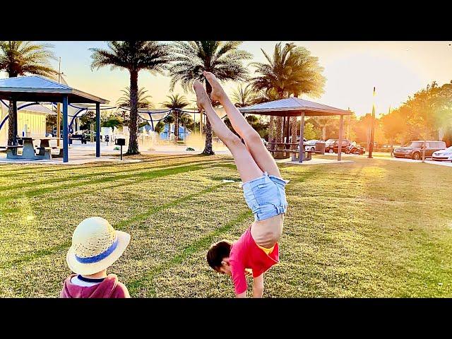 Having fun with gymnastic tricks - Karolina Protsenko with little brother