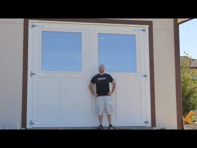 Mammoth sized carriage doors with shop made windows.