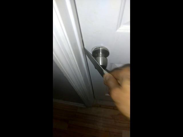 How to pop a door lock with a screwdriver or butter knife.