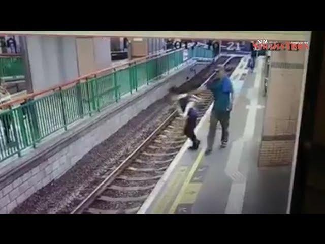 Man pushes woman onto Hong Kong rail tracks, casually walks away