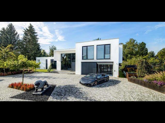 A Modern Bauhaus-Style Villa With A Car Lift That Disappears Into The Ground