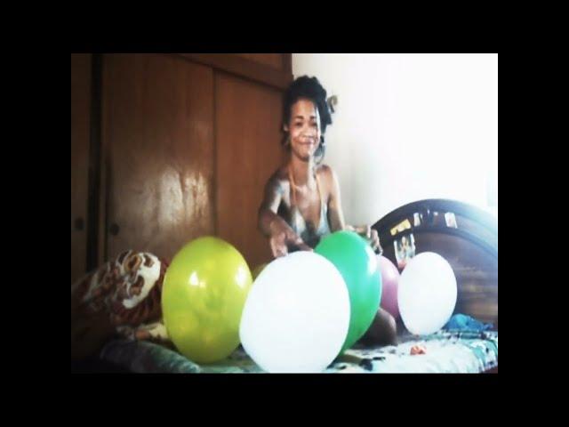 Balloon fun on her bed