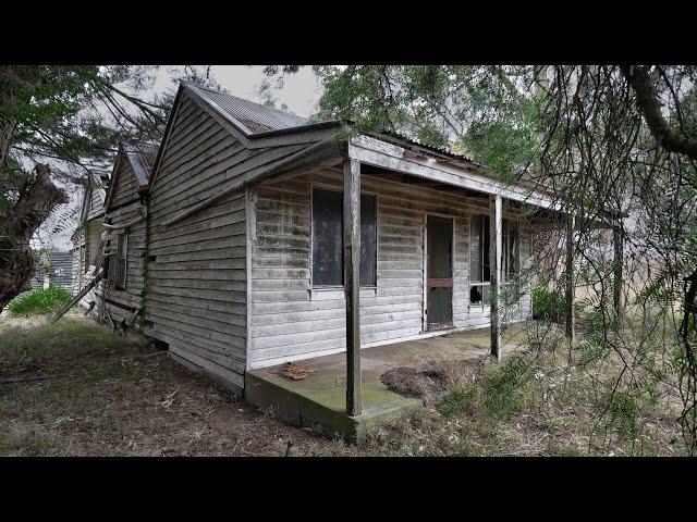 Old hidden rural cottage in the trees and an old rural Hall/School