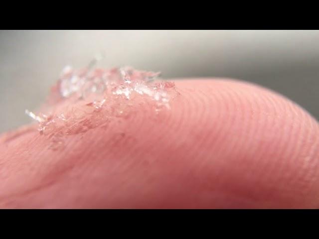 Macro of snow on fingertip 2