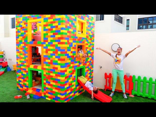 Vlad and Niki play with colored toy blocks and build Three Level House