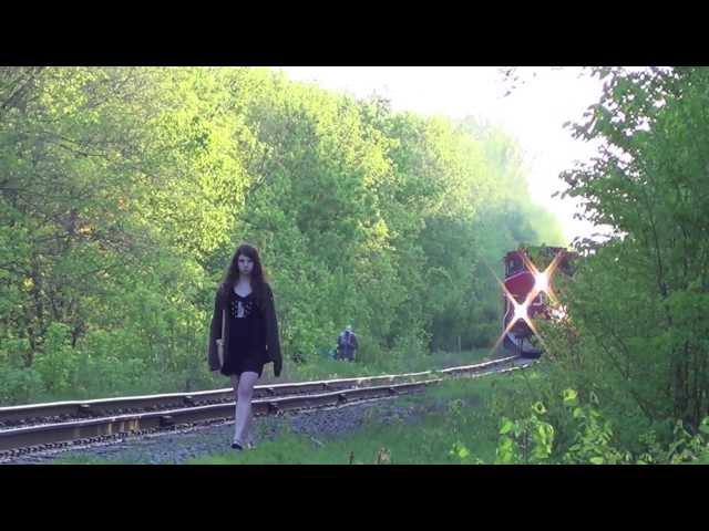 Strange Ottawa Girl walks along tracks on CN RAIL as a train approaches. #Ottawa #trains