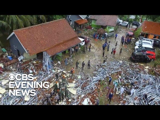 Officials in Indonesia search for victims as tsunami death toll rises