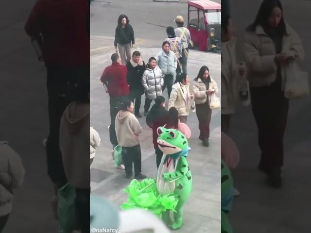 funny video of a man in a frog costume