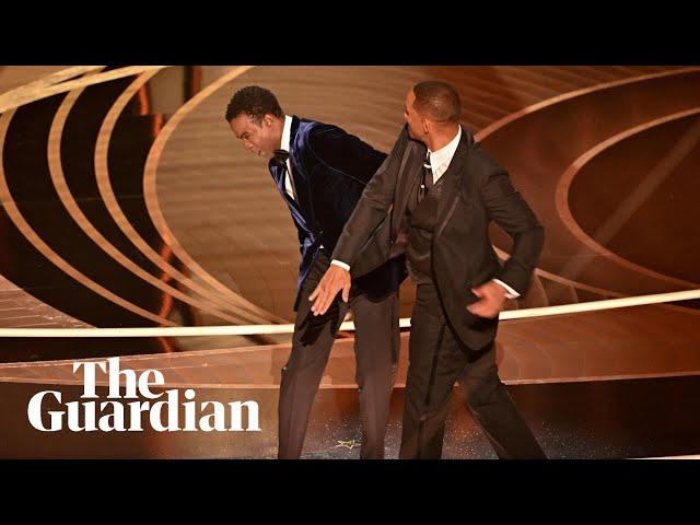 Watch the uncensored moment Will Smith smacks Chris Rock on stage at the Oscars, drops F-bomb