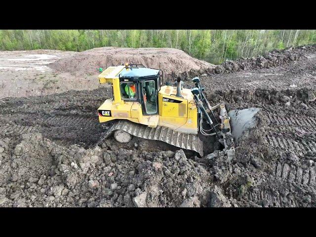 CAT D6T Pushing Out Soil