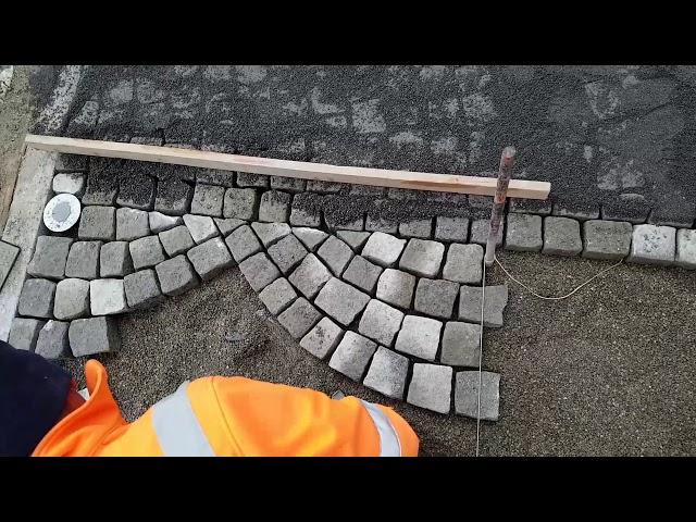 Arch paving with hammer granite stones forecourt