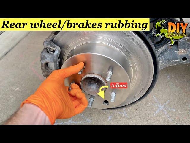 Rear brakes rubbing - Adjust emergency brake