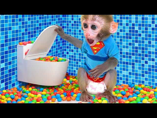 Monkey Baby Bon Bon meets rain of chocolate candy and eats rainbow milk bottle jelly with ducks