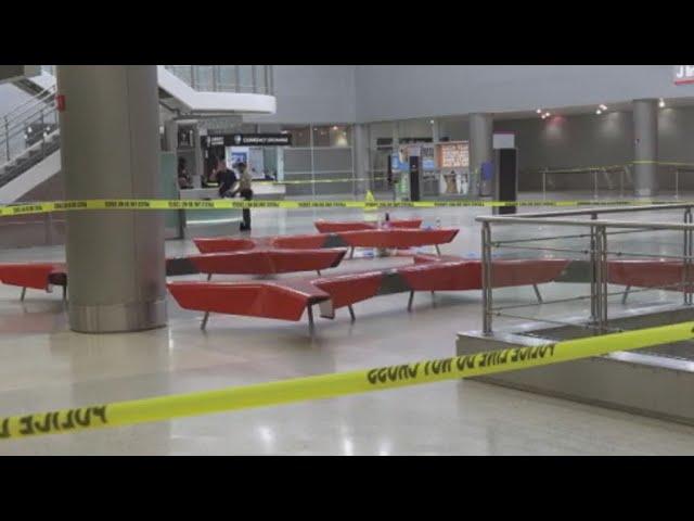 Woman stabbed at MIA, almost thrown over balcony; man arrested