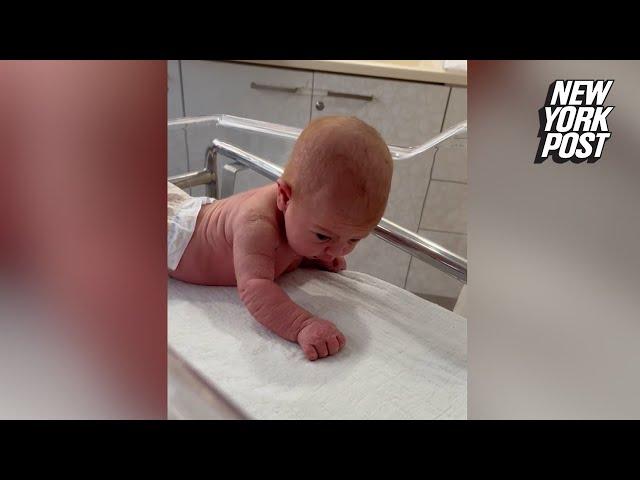 Newborn baby lifts her head and crawls at just 3 days old