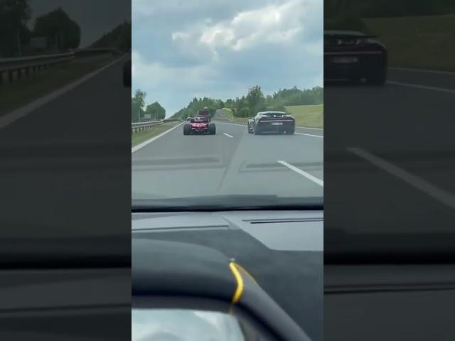 F1 car driving on the Autobahn 