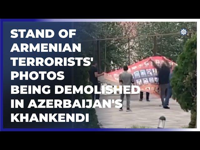 Stand of Armenian terrorists' photos being demolished in Azerbaijan's Khankendi