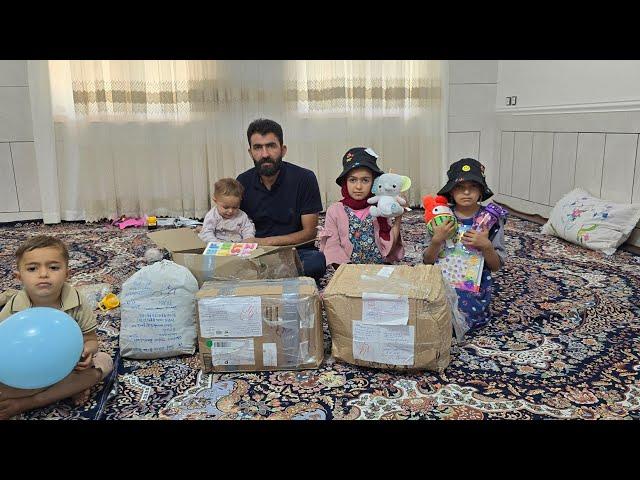 gift of happiness to nomadic family with arrival of the donated packages in the hands of engineer