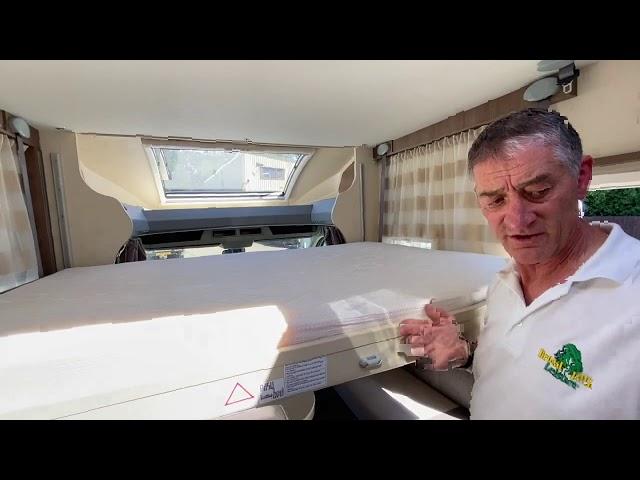 Bed demonstration in a Chausson Flash 510 motorhome