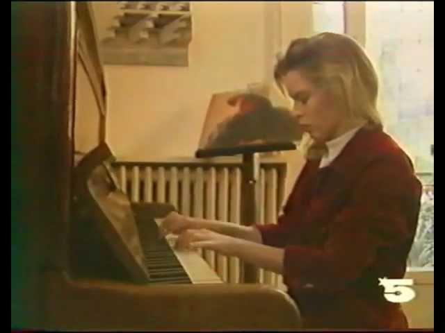 Kylie Minogue plays the piano