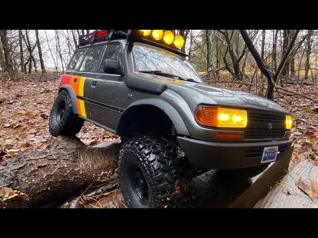 FMS FCX10 LC80 3s rainy trail run testing the stock tires capability in a wet environment