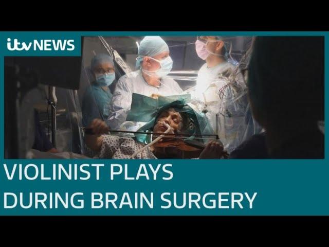 Patient plays violin while undergoing brain surgery in UK first | ITV News