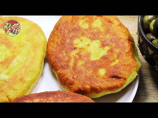 Georgian corn patties with molten suluguni (chvishtari)