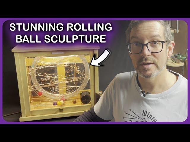 Rolling Ball Sculpture inside a glass cabinet - Story 83