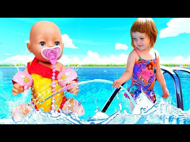 Kids play with dolls & Feeding baby dolls at the swimming pool - Baby Born doll & Family fun video.