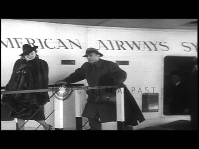 Screen actor Charles Boyer and his wife Pat Paterson leave a Clipper upon arrivin...HD Stock Footage