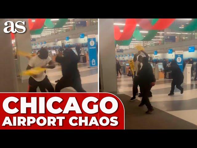 CHICAGO AIRPORT CHAOS: four men BRAWL using wet floor signs as WEAPONS