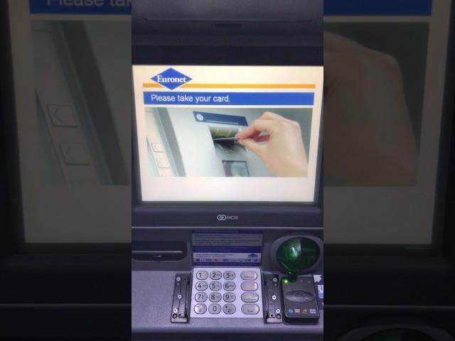 Withdrawing​ money from an ATM (Euronet), Berlin Germany 2017.