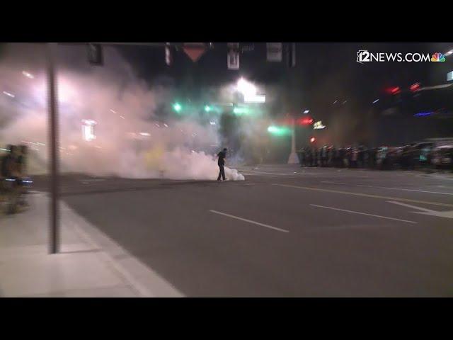 Phoenix protestors throw tear gas canisters back at police