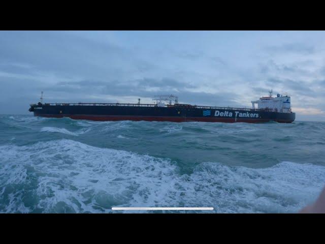 Big crude oil tanker receives a Dutch pilot before entering the port of Rotterdam