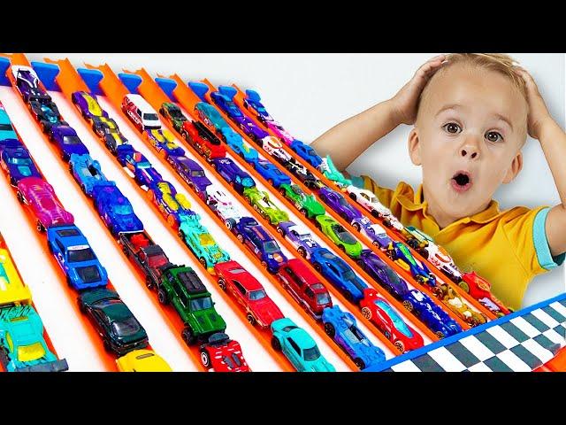 Chris plays with Hot Wheels cars and builds Hot Wheels City