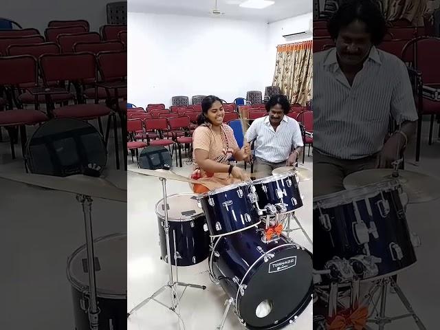 Girl playing drums rolls