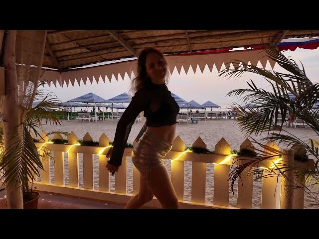 Sunset dancing of Russian blonde in Morjim Turtle beach