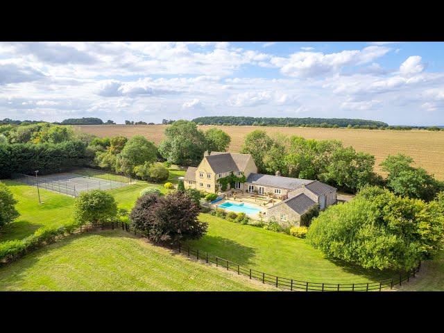 Equestrian home with 35 acres, helipad, swimming pool and tennis court