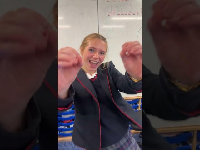 Doing TikTok in uniform tights school dance