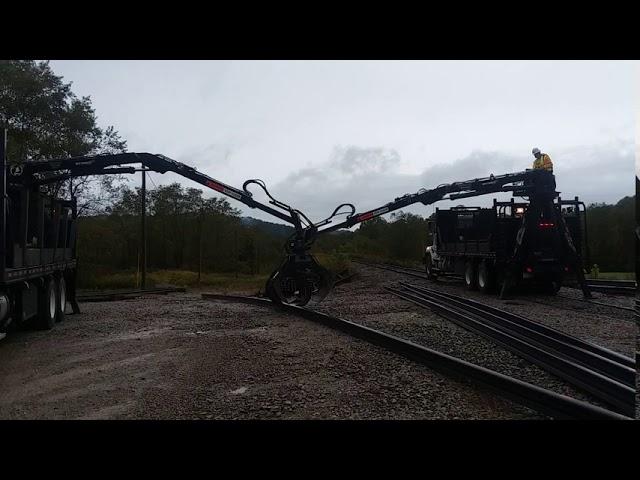 Moving 78 Foot Sticks of Rail with 2 Grapple Trucks