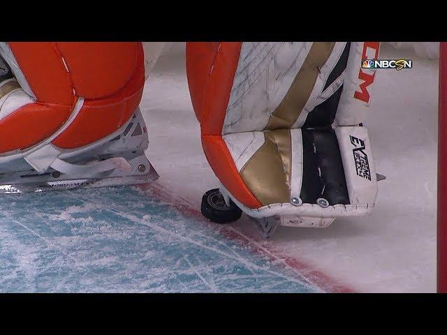 John Gibson steps on the puck on the goal line to deny Scheifele