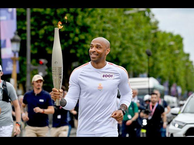 Thierry Henry Carries Olympic Flame As It Reaches Paris On Bastille Day