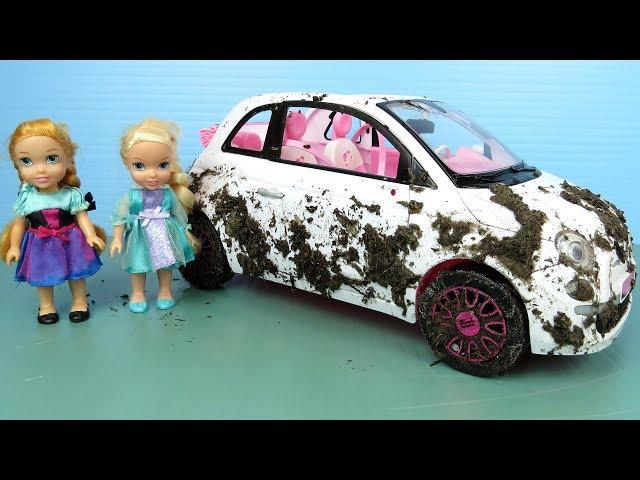 Elsa and Anna toddlers wash Barbie's cars