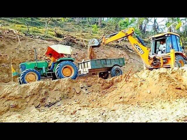 JCB 3dx backhoe loading mud in trolley with John Deere 5310/JCB backhoe loader/. mountain king jcb